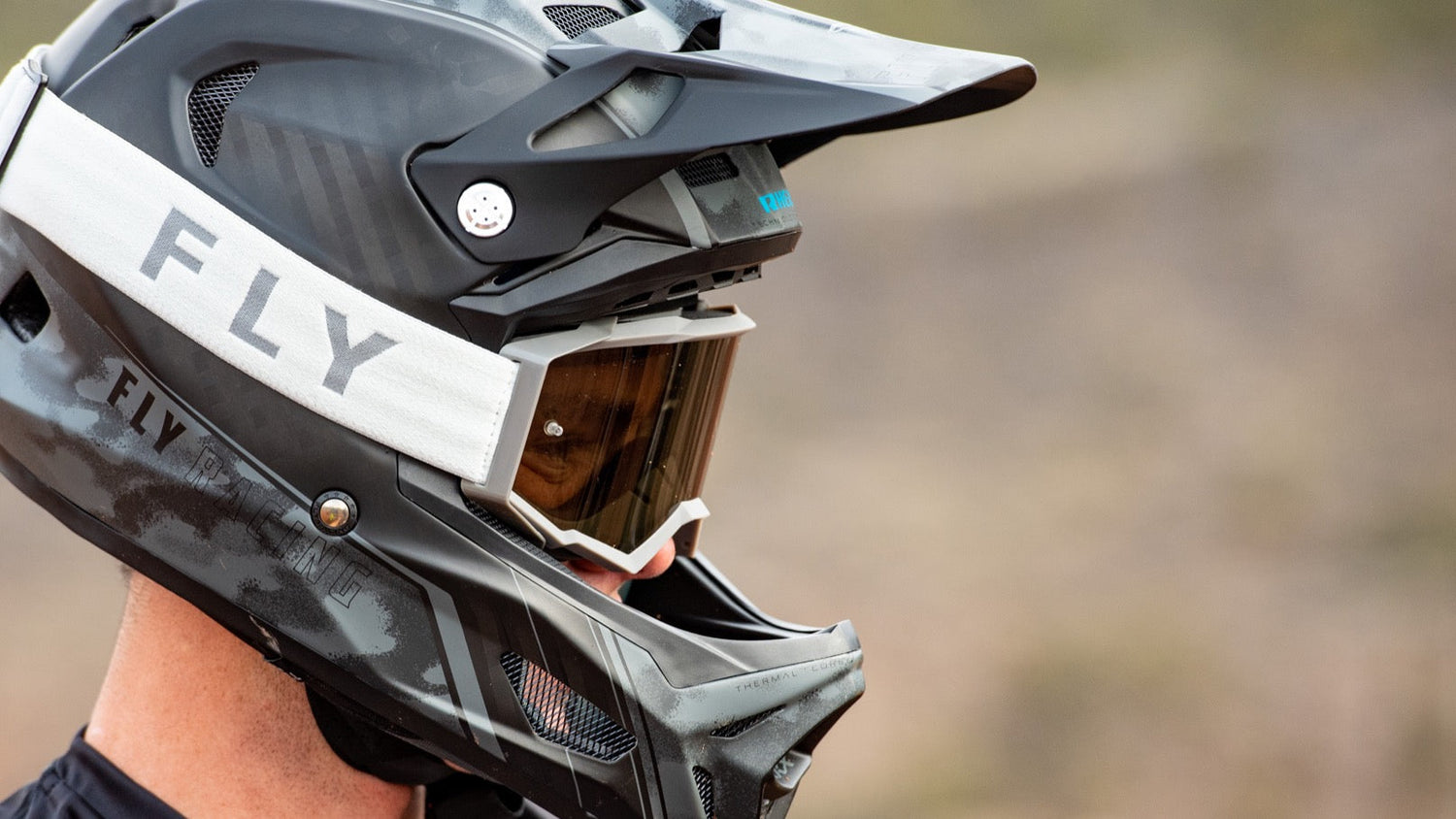 Close-up of a FLY Racing full-face helmet and goggles for eMoto riding