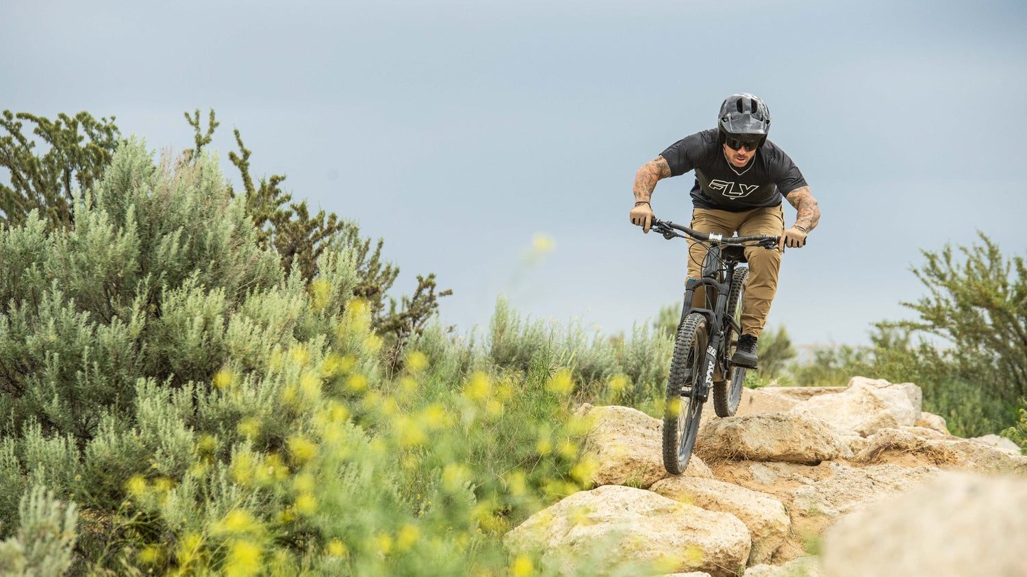 Rider moving through rocks with lightweight helmet for eMoto ventilation guide